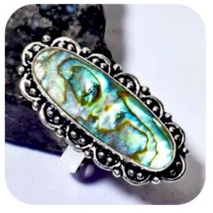 Abalone stone and silver hand made ring. Size unknown.